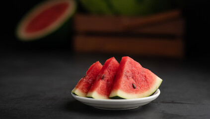 Watermelon day concept image sliced watermelon in a dark background, fresh fruits background