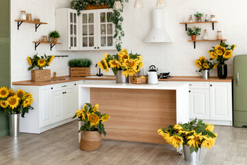 Fototapeta na wymiar Modern Kitchen Interior with Island, Sink, Cabinets, and Sunflowers in New Luxury Home.