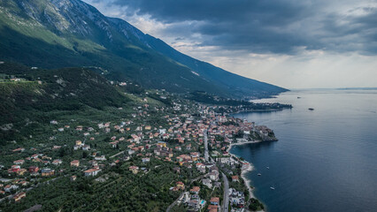 Fototapeta premium Lago Di Garda Italian drone aerial view. Mountains, lake nature view.