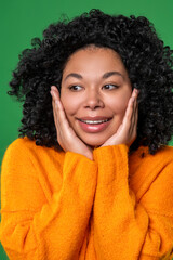 Happy dark-haired ypung woman in orange