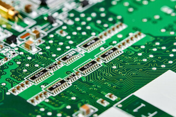 Resistors, capacitors, transistors on an electronic computer printed circuit board