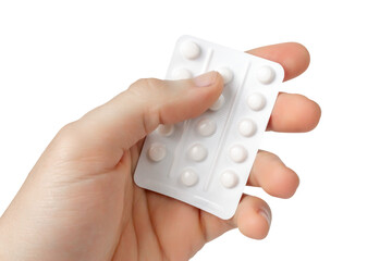 Pack of pills in hand. Isolate on a white background.