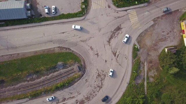 View from the height. Clip. A small fork in the road of cars with fast-moving vehicles.