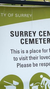 central cemetery in city of Surrey clean lawns lettering invitation to walk graves road asphalt grass Vancouver Canada Surrey 2023
