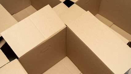 open cardboard boxes close-up, cutout for handle in cardboard box