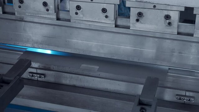 Steel machine metal press industry equipment. Creative. Hydraulic press bending steel sheet, forming metal products.