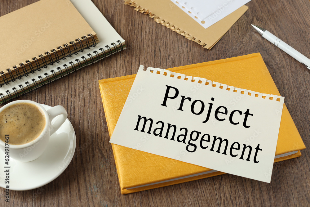 Poster beautiful yellow notepad on the work table. text on the page project management