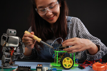 Close up Female engineer concentrate on her robot project