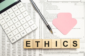 Ethics - words from wooden blocks with letters, ethics moral philosophy concept, white background