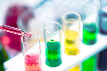 Education Laboratory, Set of glass for trial Science with the test tube, Begerglass, conical flask with the colorful  solution chemical   and microscope on the table in white background