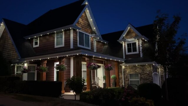 night the private sector the house is decorated with lights in the dark blue sky Surrey Vancouver Canada 2023