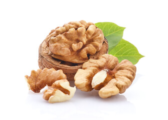 Walnuts kernel with leaves on white background
