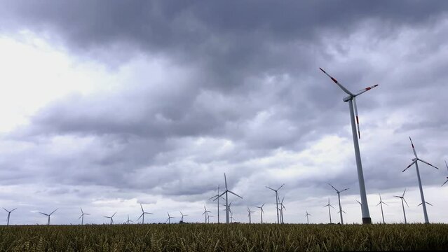 Wind turbines generate electricity when the wind is strong and the sky is very cloudy