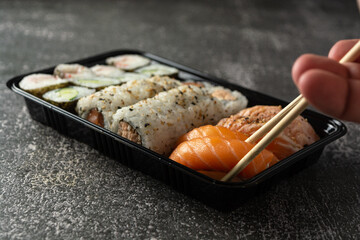sushi rolls close up on a delivery box