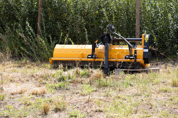lawn mower in yellow municipal, closeup