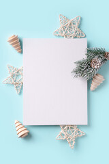 Fototapeta na wymiar Christmas and happy new year card with white decoration on blue background