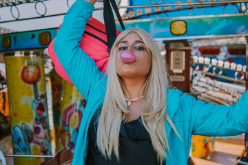 Obraz na płótnie Canvas girl with bubble gum at the party or amusement park