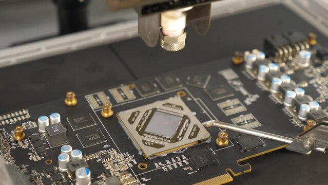 Infrared soldering station setup and GPU chip desoldering process. Maintenance and repair of computer equipment.