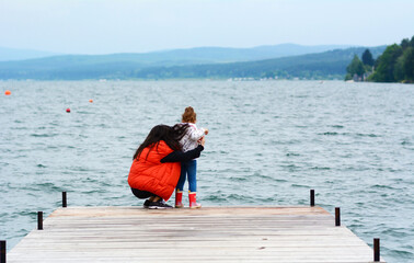 Woman and Kid Having Fun on a Lake Background  .Family Portrait in the Nature 