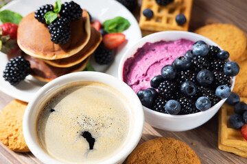 Pancakes for breakfast with blackberries. Fluffy and delicious pancakes and and in berry curd. Healthy fresh food.