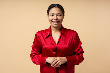 Beautiful smiling African American woman looking at camera isolated