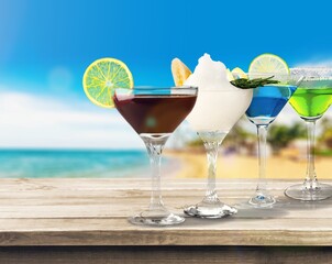 Tasty sweet cocktails in glass on the desk