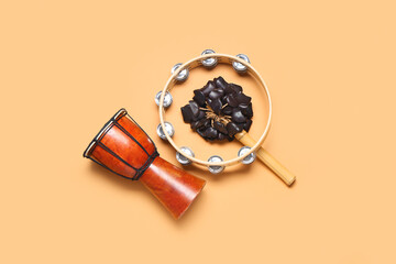 Different musical instruments on color background