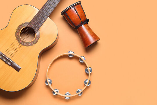 Different musical instruments on color background - Powered by Adobe