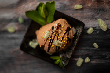 Obraz na płótnie Canvas chocolate ice cream served with mint. 