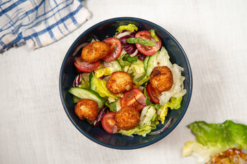 green salad with deep fried cod.