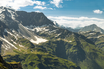 Fototapeta na wymiar Alpine alpine zone in summer, peaks with non-melting snow