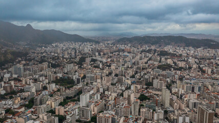 Aerial view of the North Zone of Rio de Janeiro on a cloudy day, in the neighborhoods of Tijuca and adjacencies and its green areas such as the Tijuca National Park.