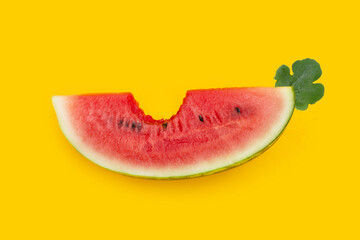 Watermelon slices on yellow background.