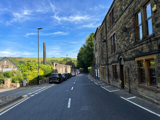 View along, Millgate, with Victorian buildings, and old trees and hills, in the far distance,...