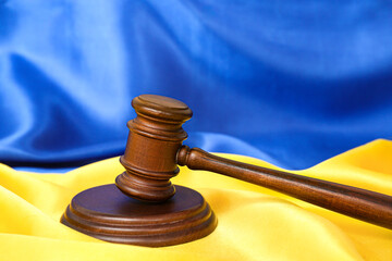 Judge's gavel on flag of Ukraine