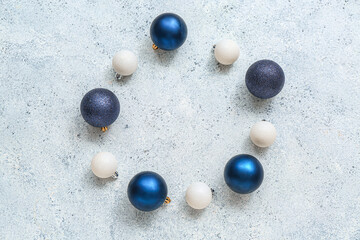 Frame made of different Christmas balls on white background