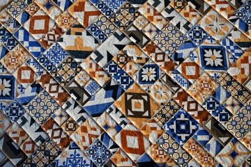 Detail of a traditional colorful tiled floor with repeating floral motifs forming beautiful ornamental patterns