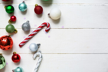 Different Christmas decorations on white wooden background