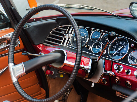 GERMANY - JUL 16, 2023: Steering Wheel and Dashboard of a Classic Red Citroen DS Cabriolet Designed by Henri Chapron