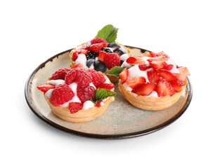 Plate of tasty tartlets with whipped cream and berries on white background