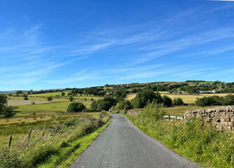 Panoramic view from, Smalden Lane of the Lancashire countryside, with dry stone walls, wild plants, fields and hills,in Grindleton, UK