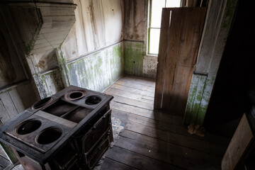 abandoned kitchen with stove