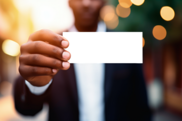 Businessman holding business card with transparent PNG background, space for writing. Generative AI