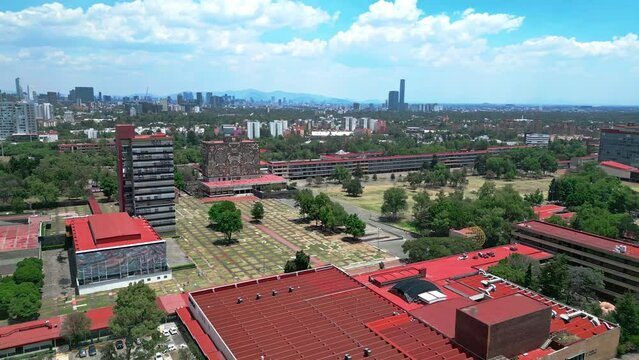 Aerial view of amazing and picturesque view of contemporary University City located in Mexico on sunny day under blue sky with clouds