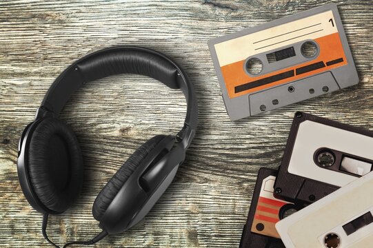 Vintage retro audio cassette and headphones on desk