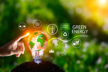 Green energy system. Businessman pointing light bulb on green background. Net zero in 2050 year....