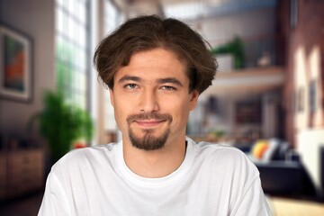 Obraz premium Young handsome man posing in room at home.
