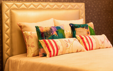 Comfortable pillows on bed in bedroom