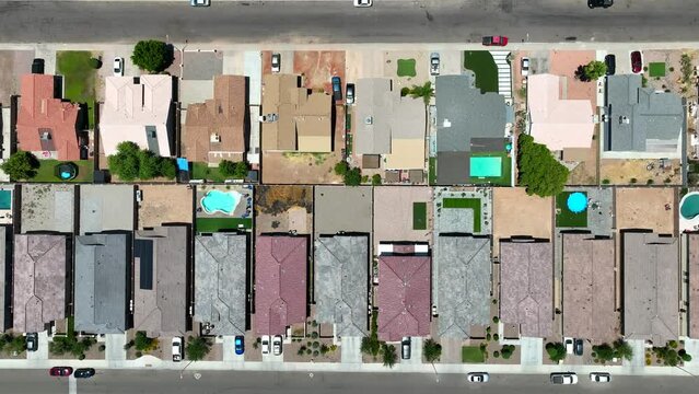 Southwest USA neighborhood. New housing development in desert region Top down aerial truck shot.