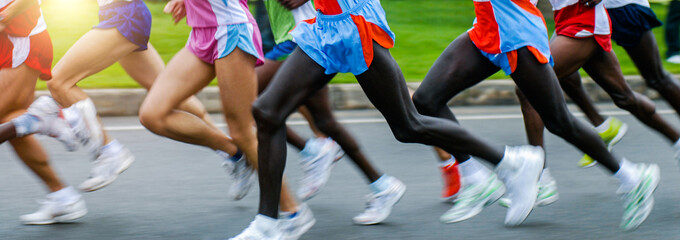 Fototapeta na wymiar Side view of athletes running in a cross country race